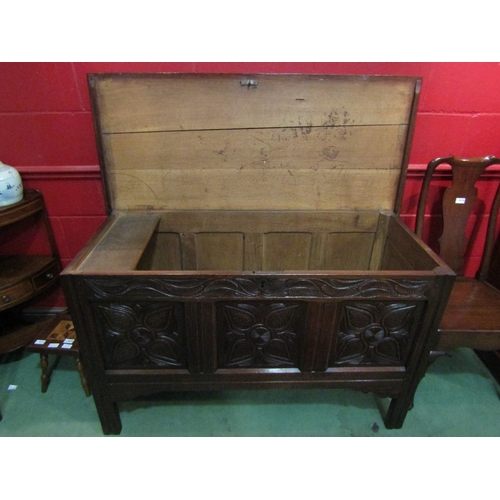 4122 - A circa 1780 pegged joined oak coffer, the split ring hinged top with internal candle/taper box over... 