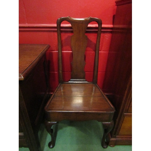 4124 - A George II English oak chair with vase shaped central splat over a flat seat and pad foot cabriole ... 