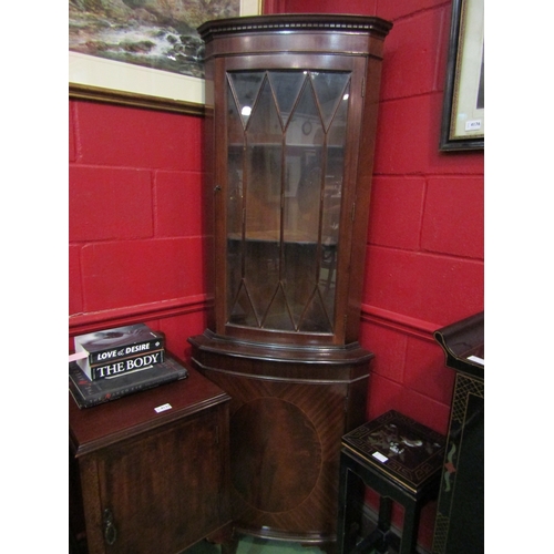 4138 - A reproduction mahogany corner cabinet with astragal glazed door, 180cm tall x 65cm wide