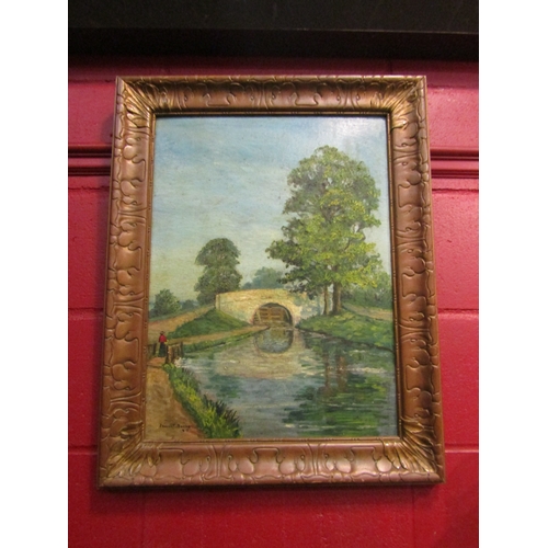 4143 - JAMES T. BANKEN: An oil on board of river scene, lady walking along path, signed and dated 1915 lowe... 