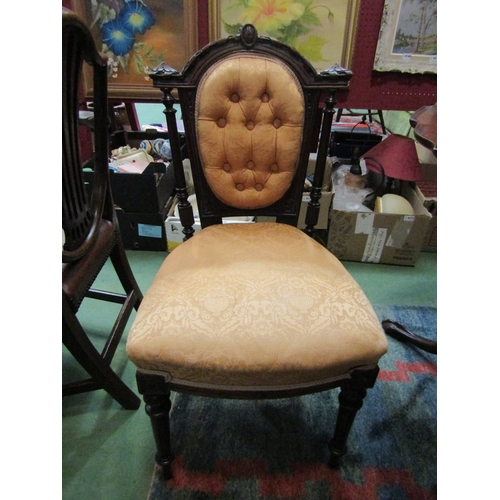 4160 - A pair of mid-Victorian walnut chairs with carved frame, button backrest on turned and tapering reed... 