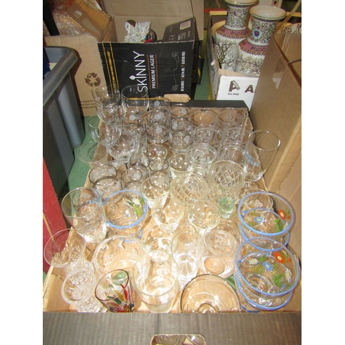 4185 - Four boxes of various glassware, mainly drinking glasses, bowls and vases. Together with a wooden bi... 