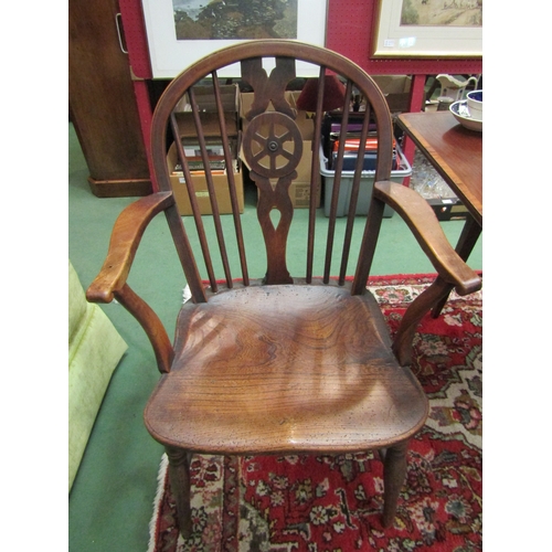 4193 - A pair of 19th Century elm seated Windsor wheel-back elbow chairs, on turned supports joined by a st... 