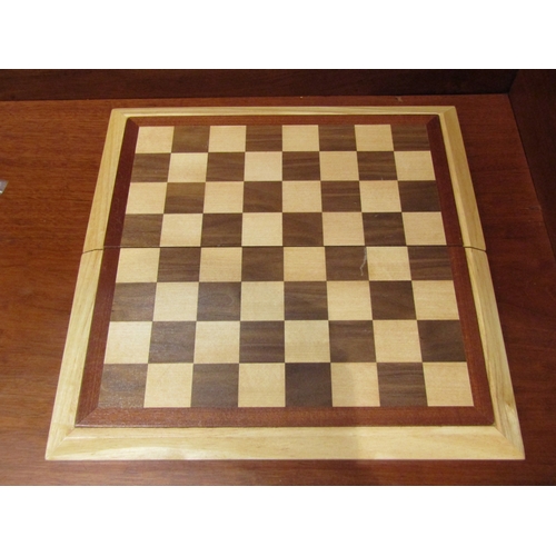 4208 - A folding wooden chess set with wooden pieces