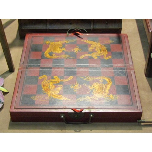 4232 - An Oriental style resin chess set, boxed with board