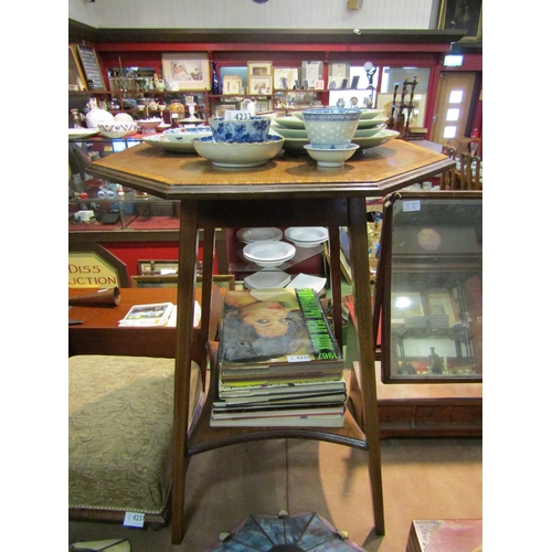 4234 - An Edwardian cross-banded mahogany occasional table with octagonal top and concave square under tier... 