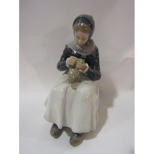 4286 - A Royal Copenhagen 1317 figure of seated lady knitting, 23cm tall