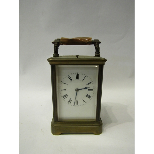 4311 - A carved oak framed wall barometer together with a brass carriage clock (both a/f)