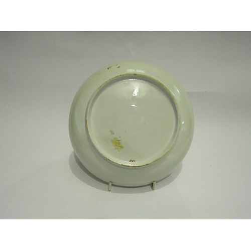 4385 - A First Period Minton plate, 150 in puce to base, 18.5cm diameter