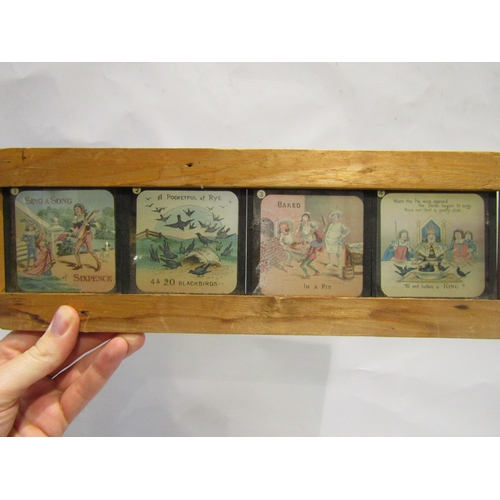 4390 - A framed set of eight magic lantern slides for 'Sing a Song of Sixpence', one slide a/f, and an oleo... 