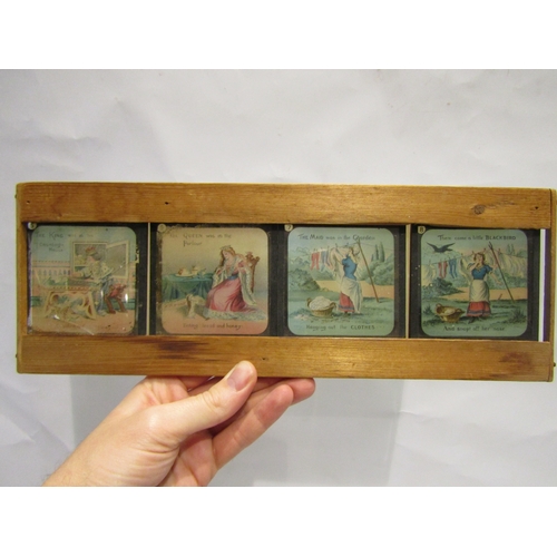 4390 - A framed set of eight magic lantern slides for 'Sing a Song of Sixpence', one slide a/f, and an oleo... 