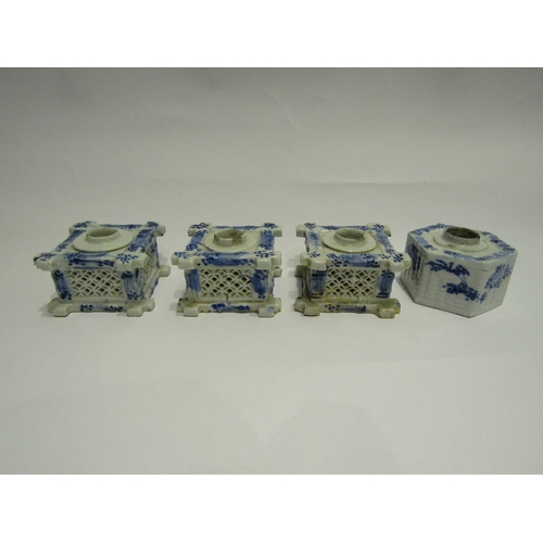 4393 - A group of four blue and white ceramic inkwells, three with lattice-work sides in split bamboo form,... 