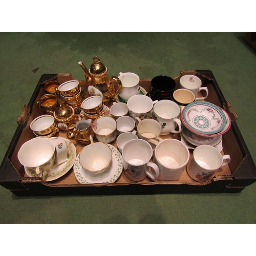 4399 - Two boxes of assorted tea wares and ceramics including a gilt tea set, Aynsley, various mugs etc.