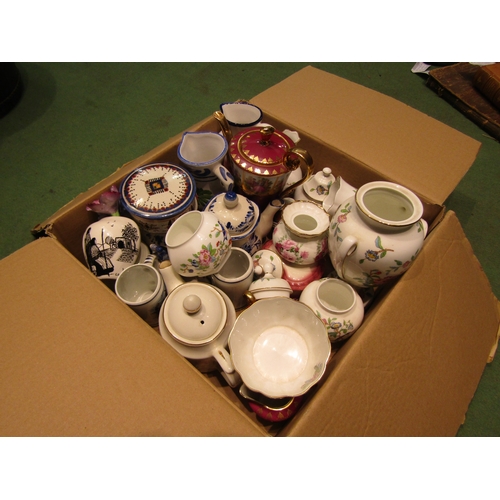 4399 - Two boxes of assorted tea wares and ceramics including a gilt tea set, Aynsley, various mugs etc.