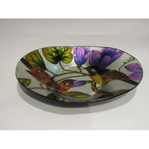 4410 - A coloured glass oval bowl decorated with birds and blossom, 38cm long