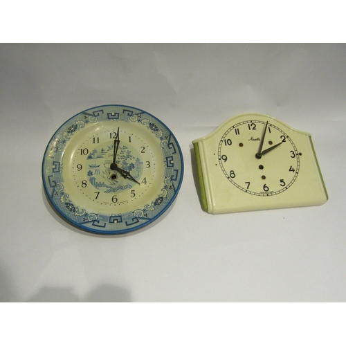 4416 - A circa 1930's porcelain kitchen wall clock, marked Mauthe, 9.5