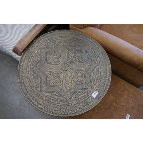 2003 - A 1930's Oriental brass top folding table with Tigers head design