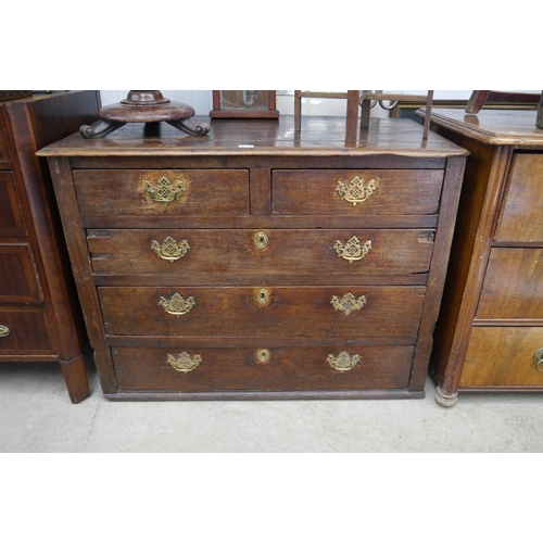 2101 - A Jacobean oak two over three chest of drawers, bottom drawer fixed shut