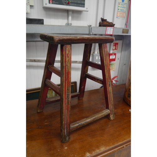 2103 - A Chinese elm stool with red paint finish