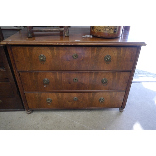 2105 - A 19th Century Continental walnut chest of three drawers