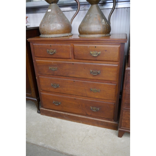 2242 - An Edwardian walnut two over three chest of drawers