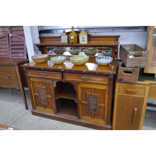 2274 - A late Victorian oak mirror-back sideboard with two drawer and two door cupboard base with central a... 