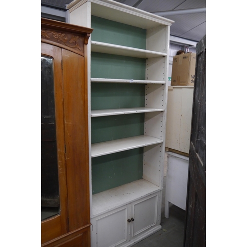 2362 - An Edwardian painted pine full height bookcase over cupboard