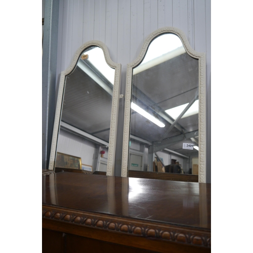 2409 - A pair of white framed mirrors