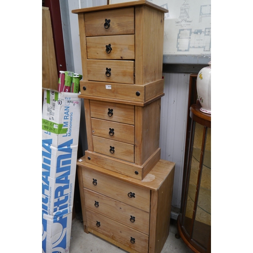 2419 - A pine chest of three drawers together with a matching pair of three drawer bedside chests (3)