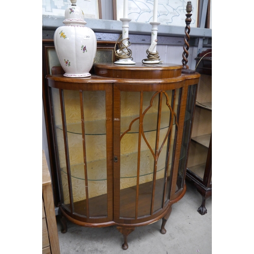 2422 - A 1930's walnut bow fronted display cabinet