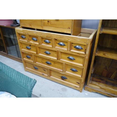 2430 - A modern pine chest of 13 drawers, cup handles, no top