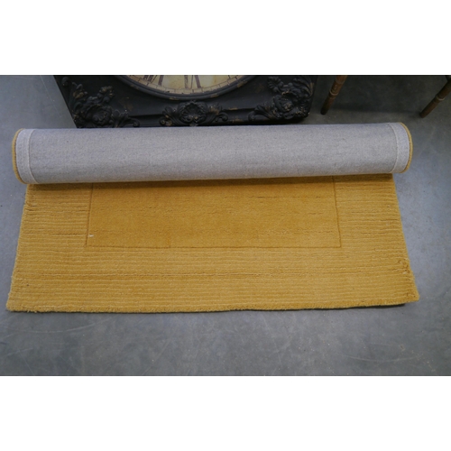 2453 - A Dunelm ochre rug 120 x 170cm