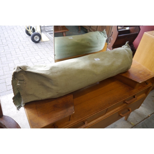 2471 - An ex militay canvas and timber folding camp bed in bag