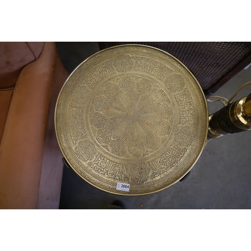 2004 - A 1930's Islamic brass top table on folding wooden legs