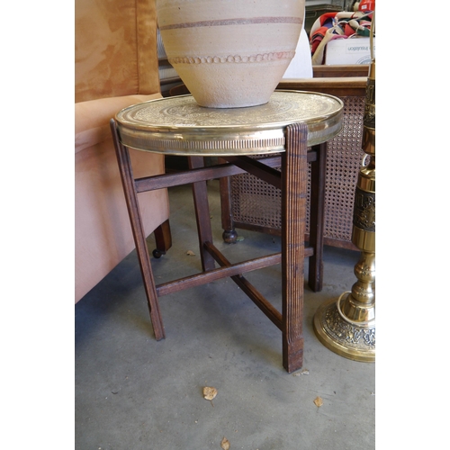 2004 - A 1930's Islamic brass top table on folding wooden legs