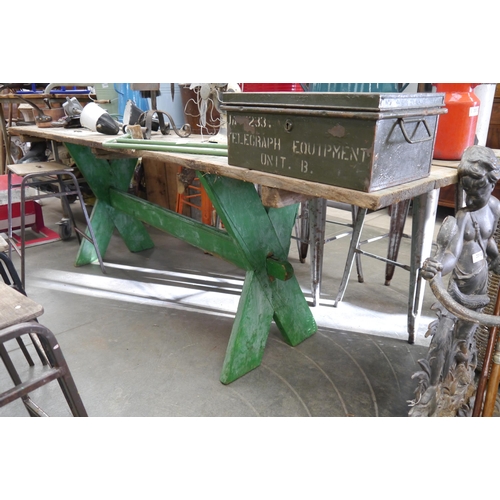 2027 - A large pine cross framed rustic table with green painted base, 253cm x 80cm