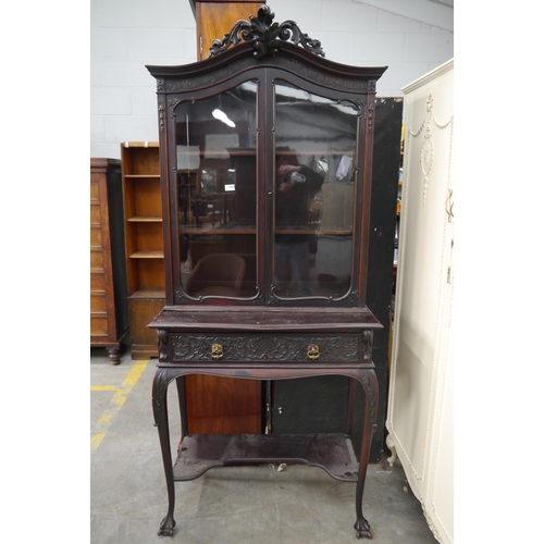 2358 - A late 19th Century carved mahogany display cabinet on stand