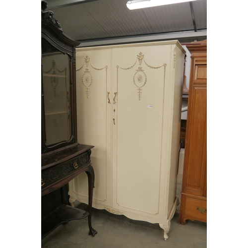 2359 - A French cream and gilt two door wardrobe