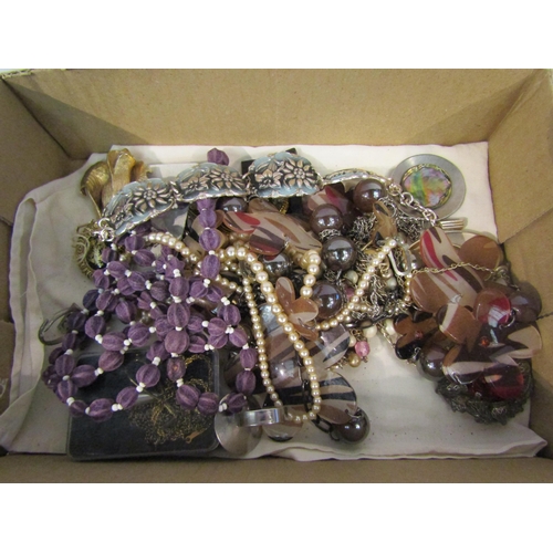 4330 - A tub containing an assortment of costume jewellery including necklaces, brooches and rings