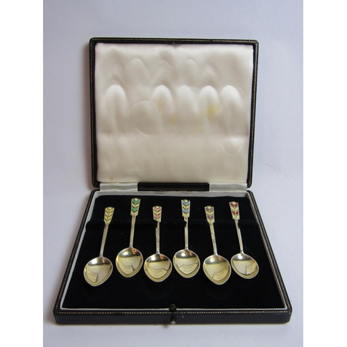 4359 - A Turner & Simpson set of six silver gilt and enamelled coffee spoons.  Birmingham 1913.  Cased