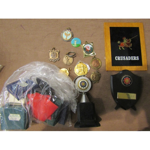 4432 - A box of archery medals, trophies and patches etc.