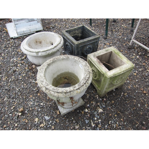 3350 - A pair of composition urns and two square form planters