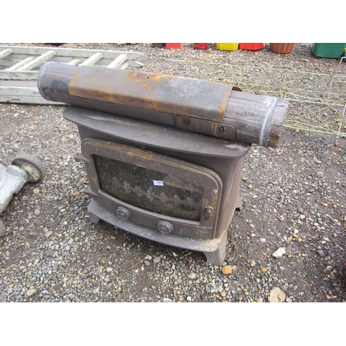 3367 - A cast wood burner with flue