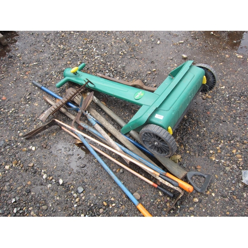 3381 - A bundle of tools including a seed spreader, etc