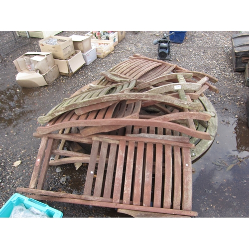 3397 - A circular hardwood garden table with six chairs