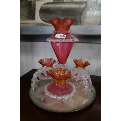 1179 - A Victorian epergne, pink glass and palm tree branch design on mirrored stand, approximately 33cm ta... 