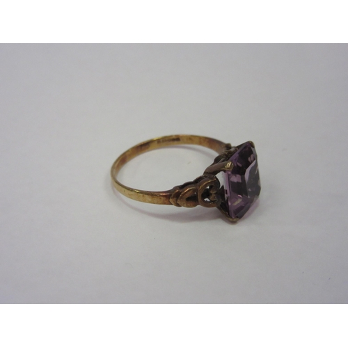 1292 - A gold ring, stamped 375, set with pink facet cut semi-precious stone