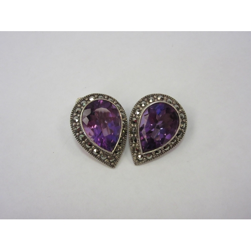 1303 - A pair of amethyst and marcasite clip earrings, marked 925