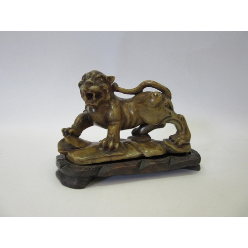 1317 - A late 19th Century Oriental carved soapstone figure of a lion, character mark signature to base, on... 