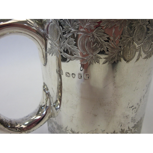 1326 - A silver tankard with etched leaf and fruit design, marked London 1872, Goldsmiths Alliance Limited,... 